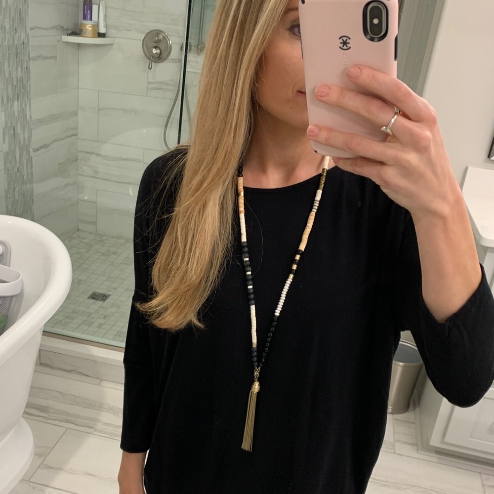 Long black and white necklace with tassel